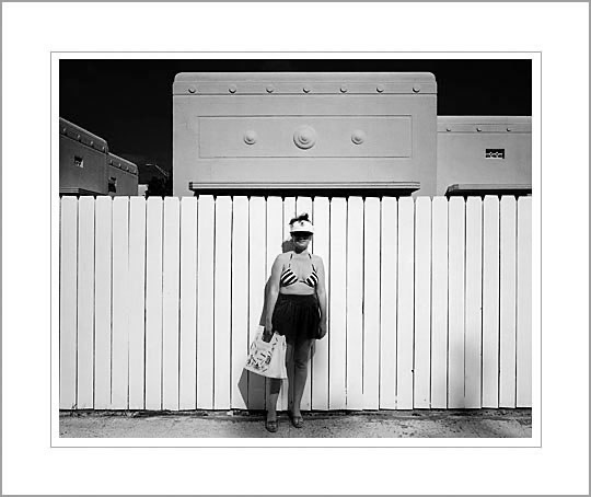 Woman and White Fence